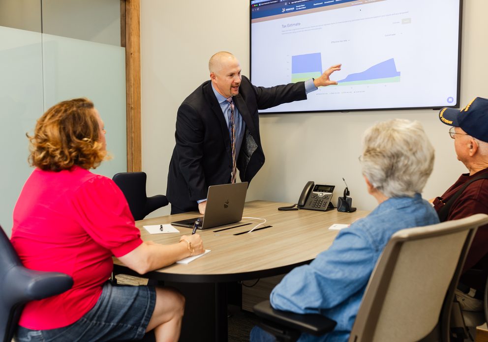 An advisor walking a group of clients through a financial plan
